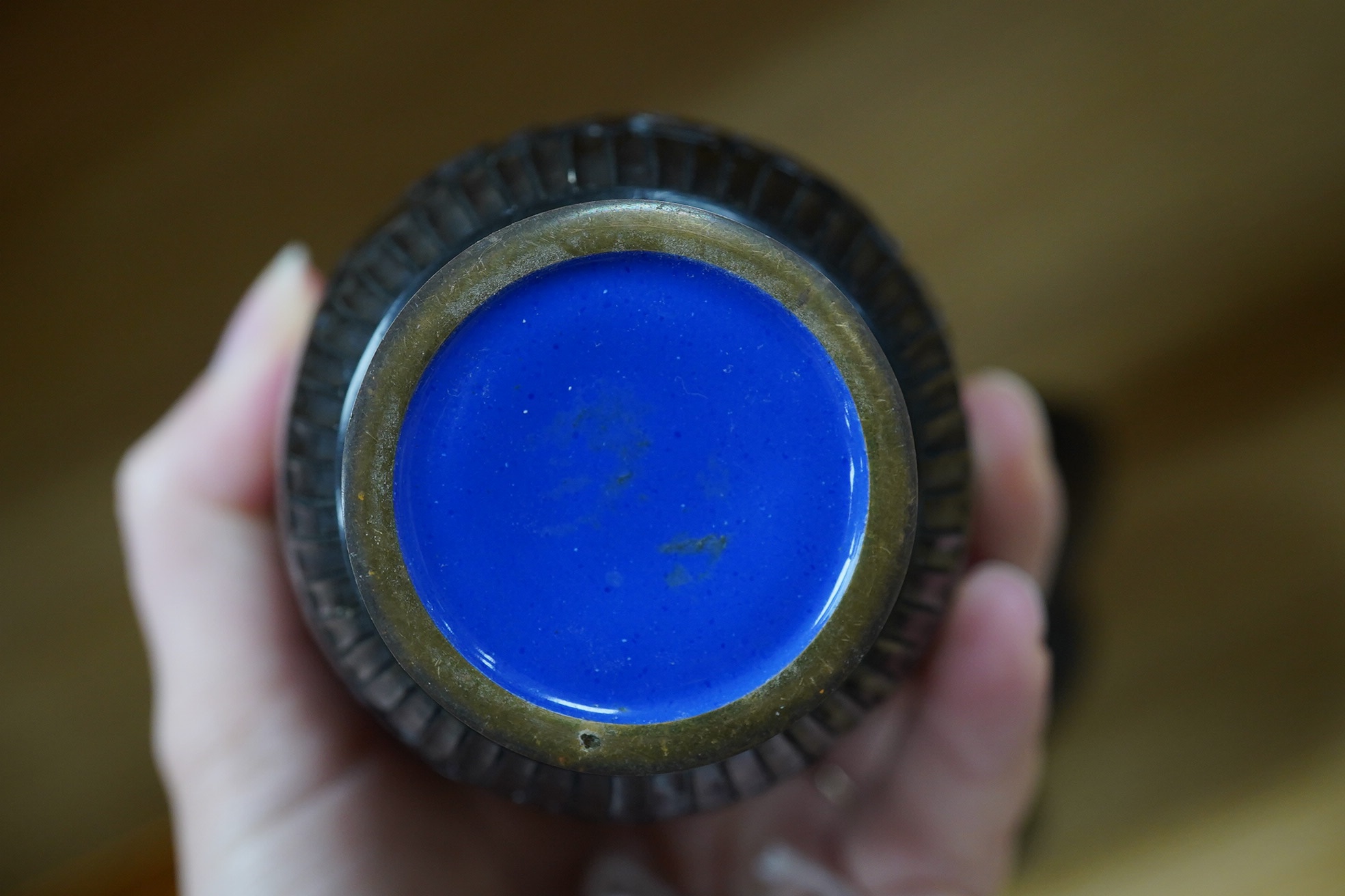 A Chinese bronze bowl, 17cm diameter, a lacquer vase, 15cm high, and a Chinese hand mirror with ivory inlay (3). CITES Submission reference 1UK5HNLM. Condition - fair to good